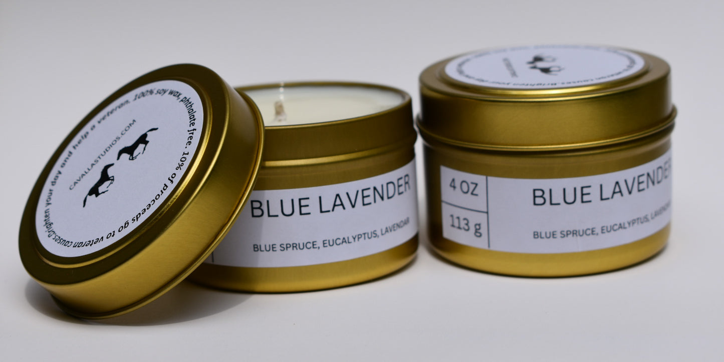 Golden tin candles with white label featuring Blue lavender Candle in small travel size candle.
